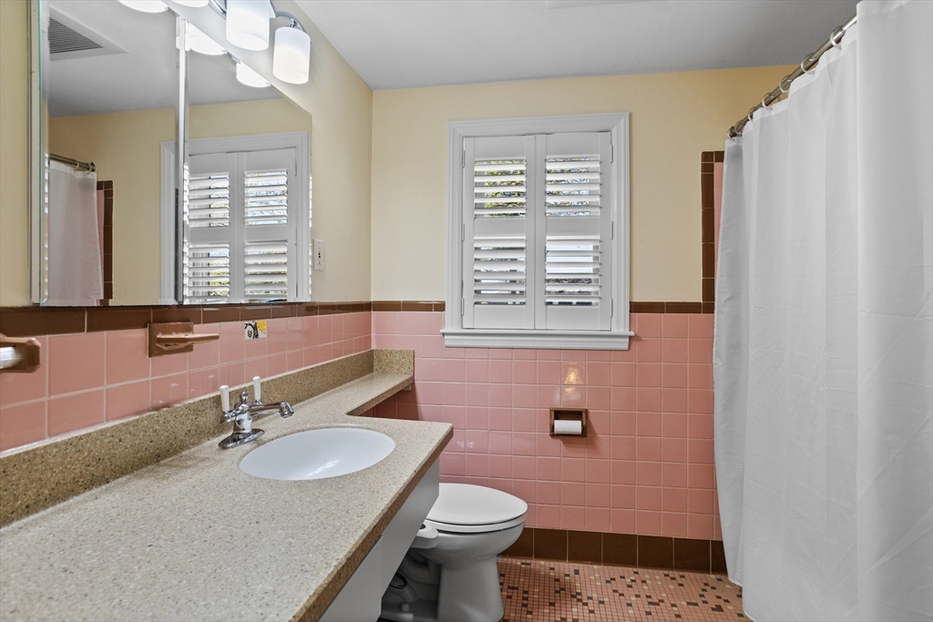 17 Hamblen Street Lexington, MA 02421 - Photo 29 of 42 a bathroom with a sink toilet and a mirror
