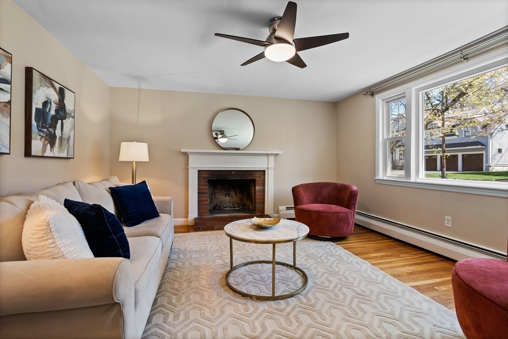 17 Hamblen Street Lexington, MA 02421 - Photo 3 of 42 a living room with furniture a rug and a fireplace