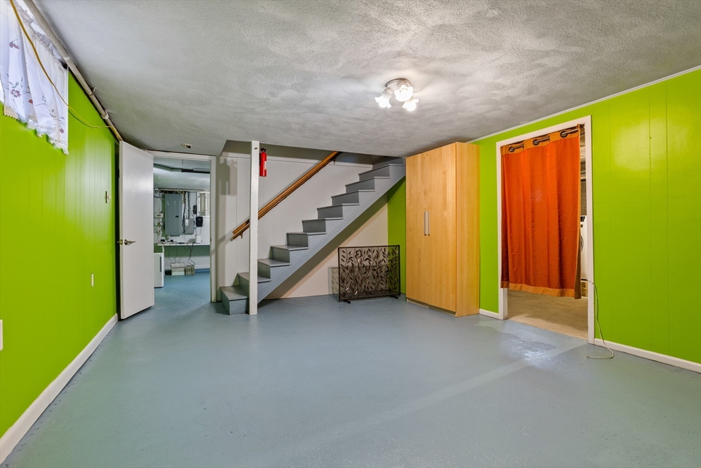 17 Hamblen Street Lexington, MA 02421 - Photo 35 of 42 a view of an empty room with stairs
