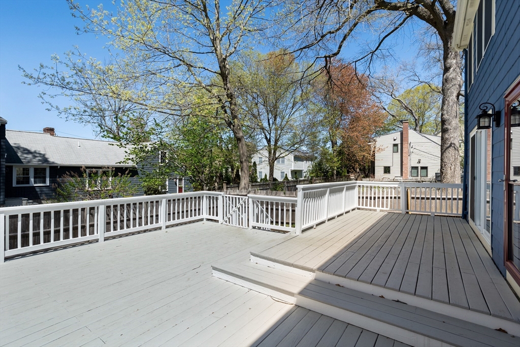 17 Hamblen Street Lexington, MA 02421 - Photo 40 of 42 a view of backyard with deck and wooden floor