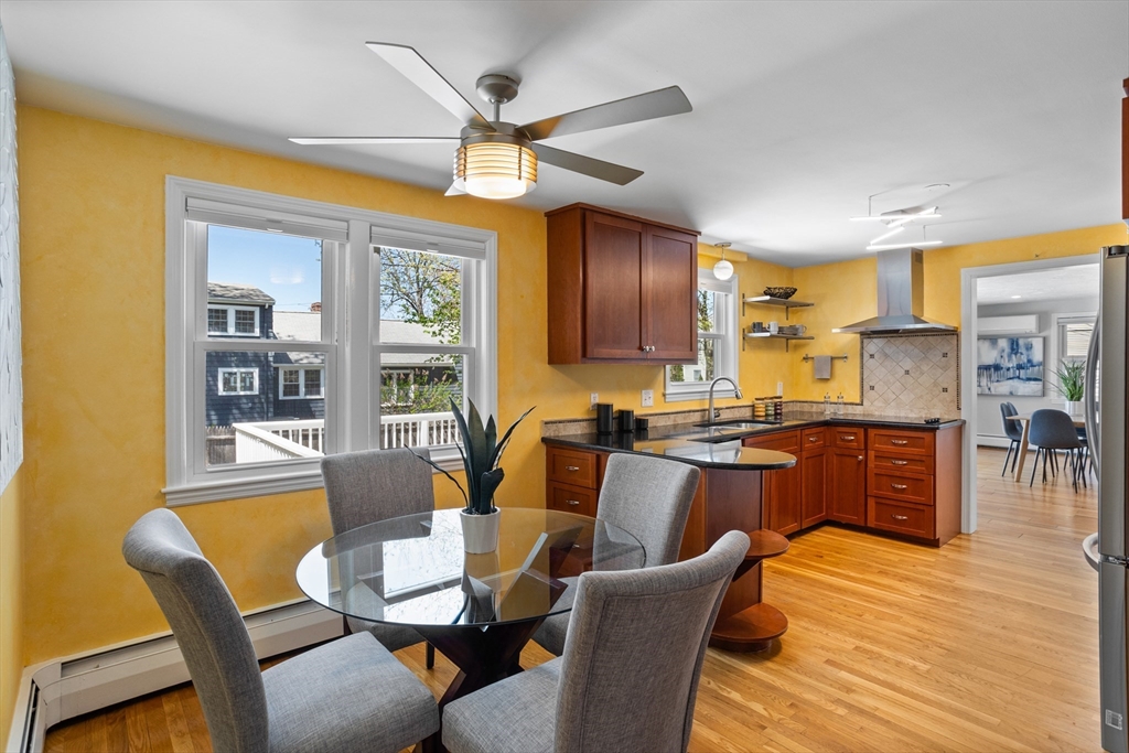 17 Hamblen Street Lexington, MA 02421 - Photo 5 of 42 a view of a dining room with furniture a chandelier and wooden floor