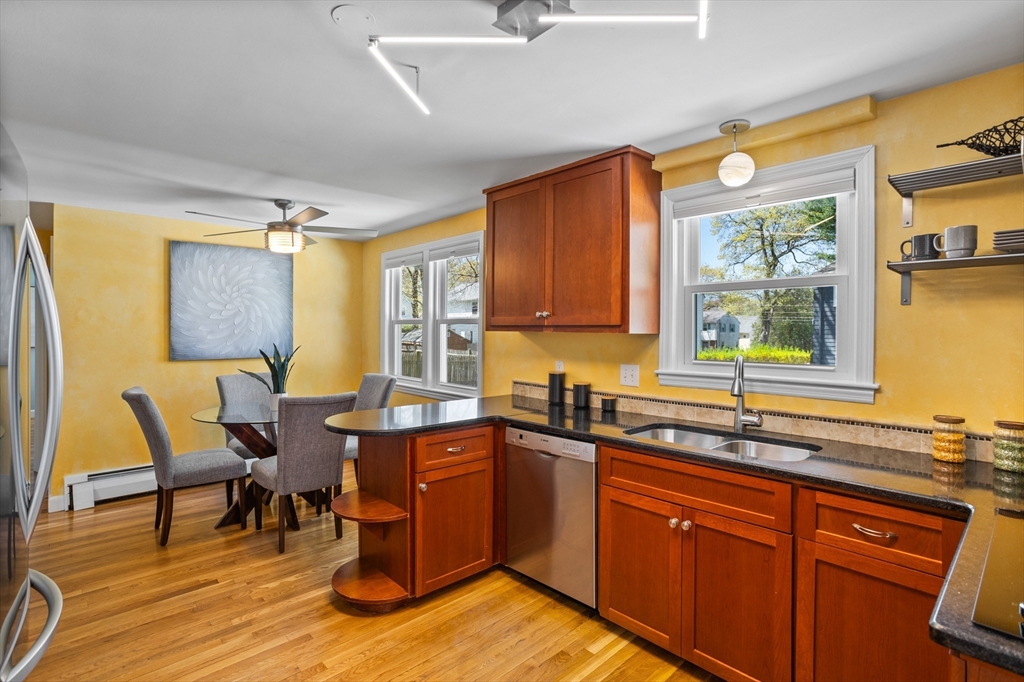 17 Hamblen Street Lexington, MA 02421 - Photo 8 of 42 a kitchen with a sink and wooden cabinets