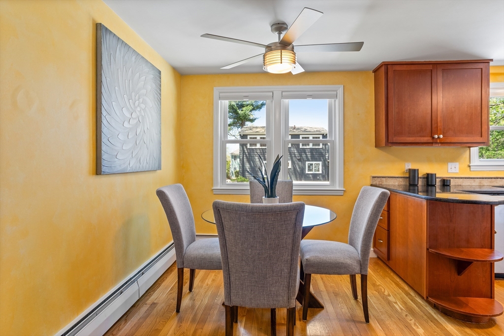 17 Hamblen Street Lexington, MA 02421 - Photo 10 of 42 a view of a dining room with furniture a chandelier and wooden floor
