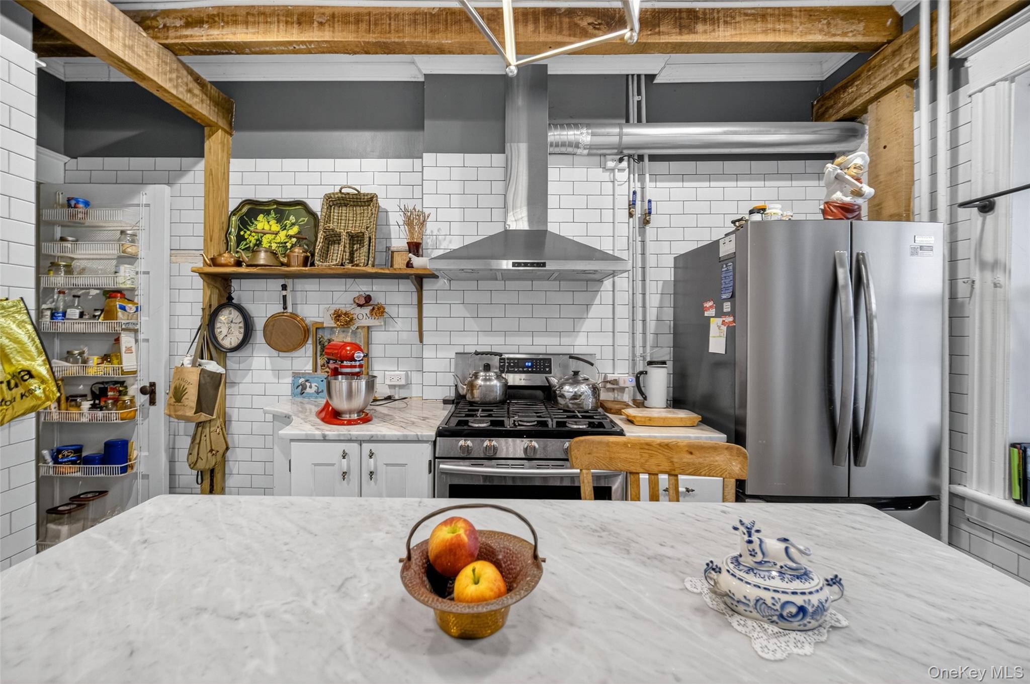 111 South Hamilton Street Poughkeepsie, NY 12601 - Photo 19 of 46 a kitchen with stainless steel appliances kitchen island granite countertop a refrigerator and a stove