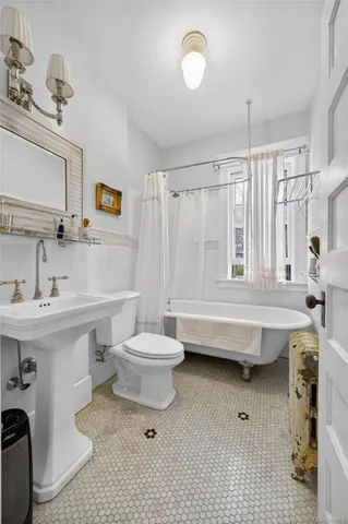 a bedroom with bed and window