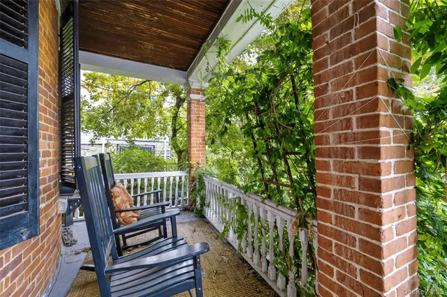 a view of a balcony with wooden floor