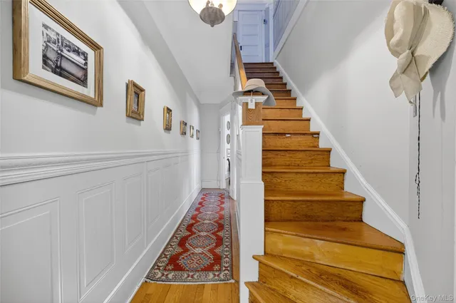 a view of staircase with wooden floor