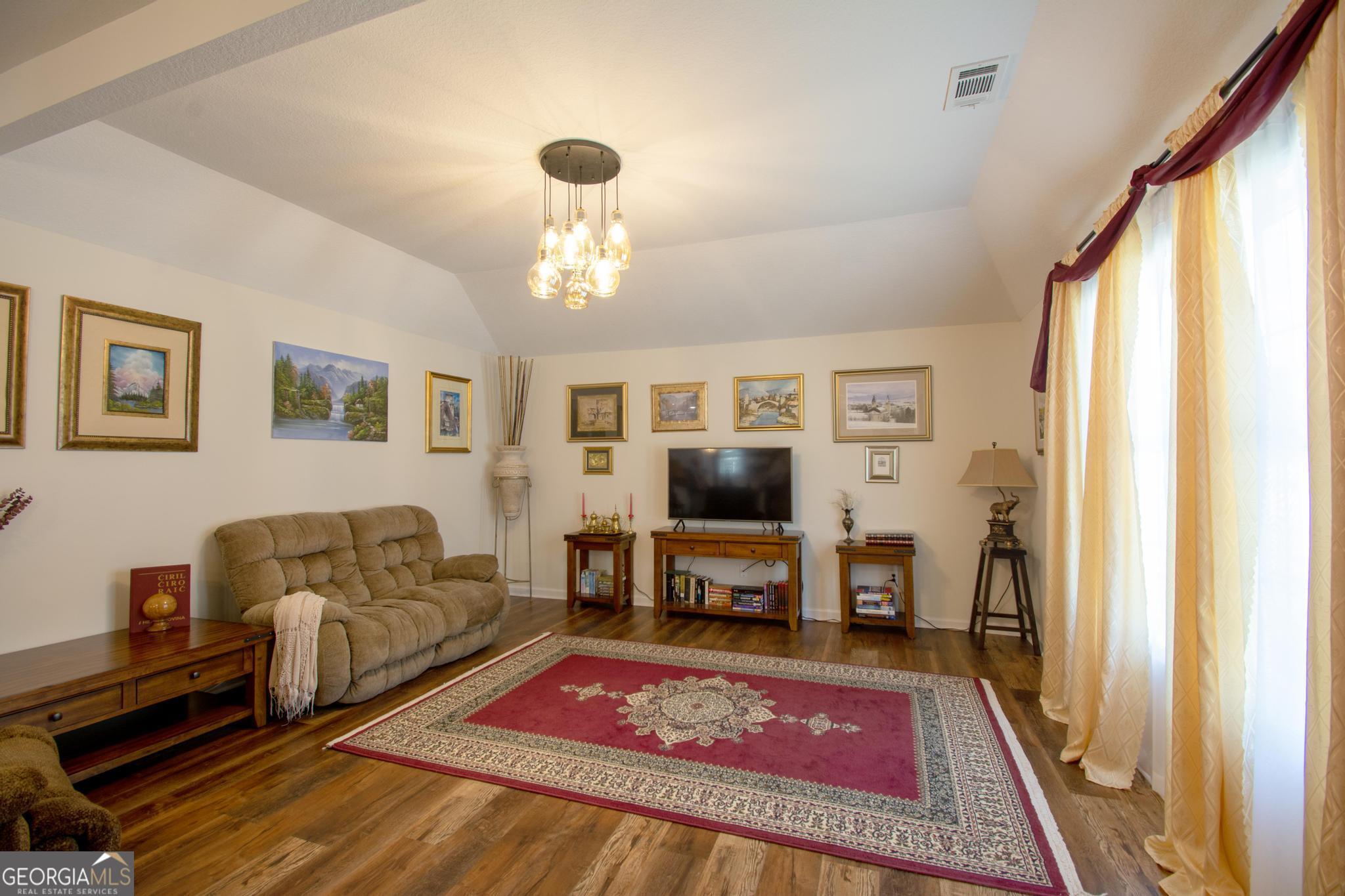 149 Main Street Rocky Ford, GA 30455 - Photo 2 of 44 a living room with furniture and a flat screen tv