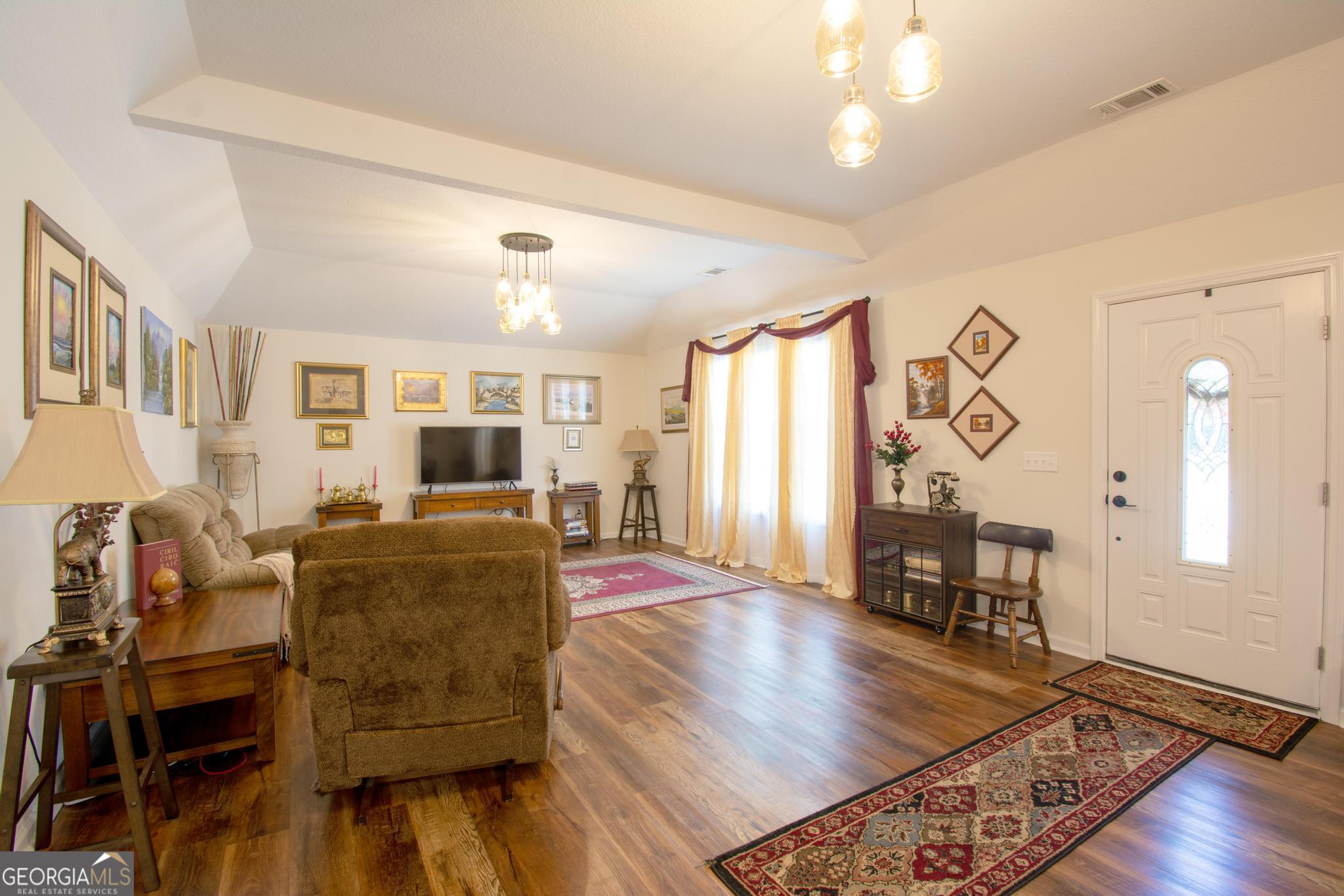 149 Main Street Rocky Ford, GA 30455 - Photo 22 of 44 a living room with furniture and wooden floor