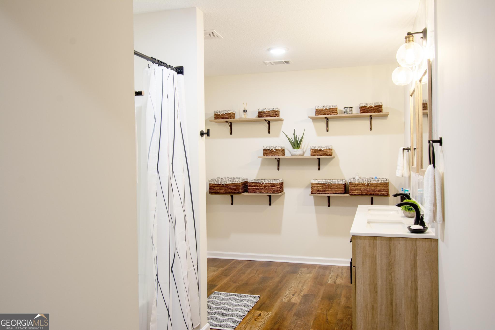 149 Main Street Rocky Ford, GA 30455 - Photo 26 of 44 a view of a living room with furniture and a flat screen tv
