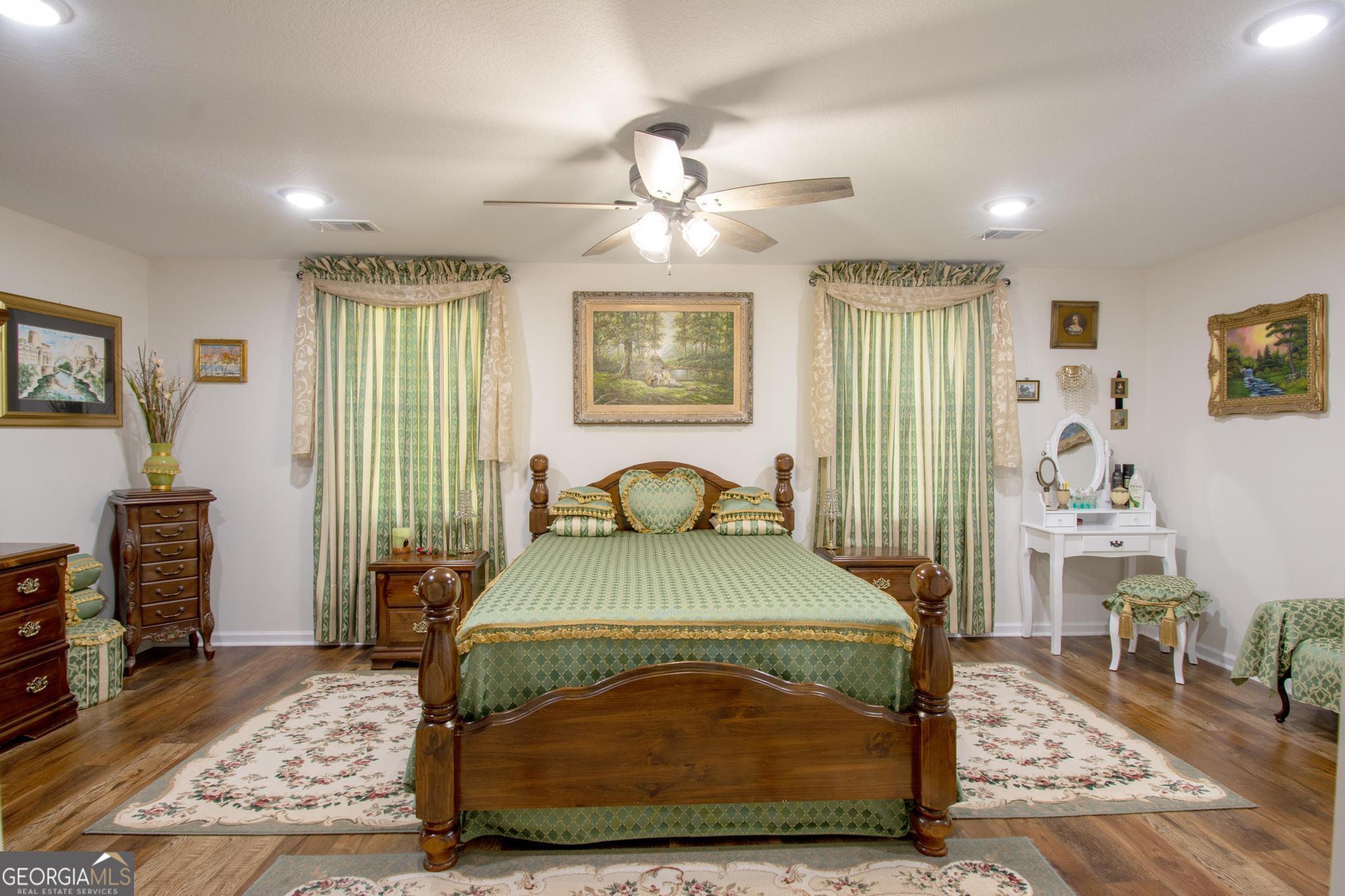 149 Main Street Rocky Ford, GA 30455 - Photo 31 of 44 a bedroom with a bed and wooden floor