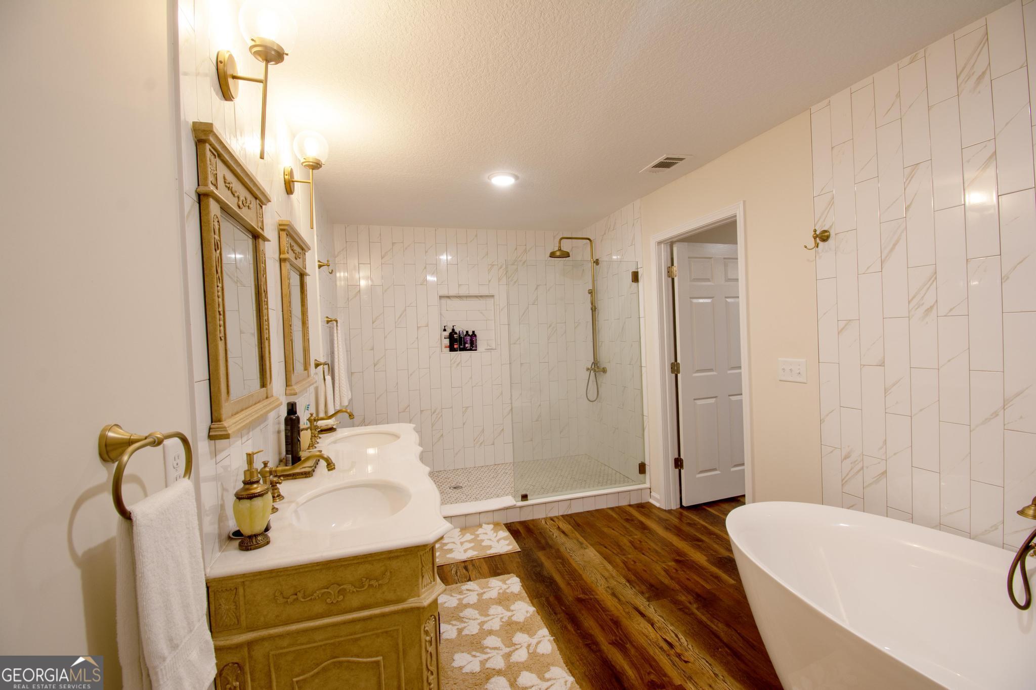 149 Main Street Rocky Ford, GA 30455 - Photo 37 of 44 a bathroom with a tub sink and mirror