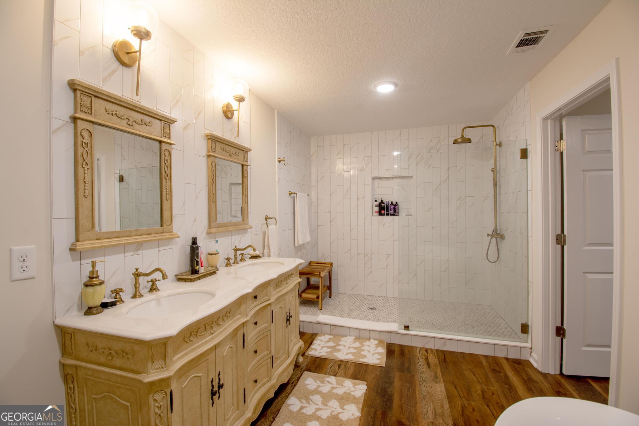149 Main Street Rocky Ford, GA 30455 - Photo 38 of 44 a bathroom with a tub sink mirror and shower