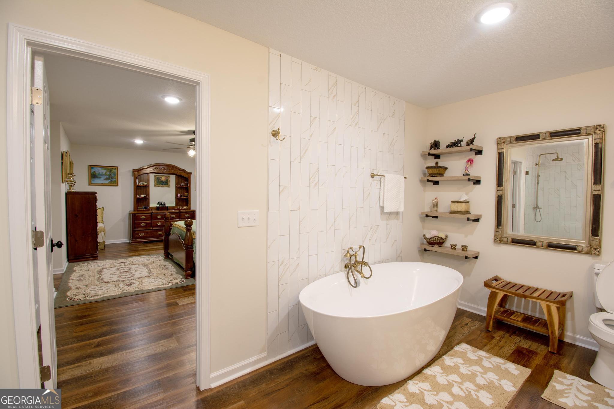 149 Main Street Rocky Ford, GA 30455 - Photo 40 of 44 a spacious bathroom with a bathtub and shower