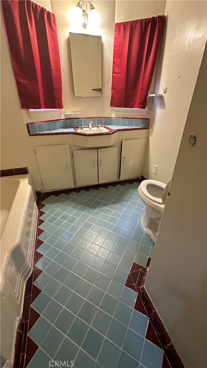 1888 Orchard Lane Merced, CA 95340 - Photo 14 of 28 a view of a bathroom with washing machine and sink