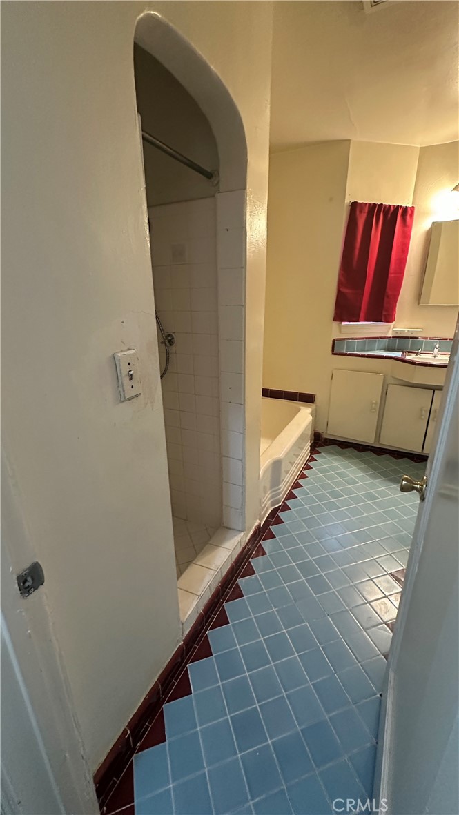 1888 Orchard Lane Merced, CA 95340 - Photo 15 of 28 a bathroom with a tub and a shower