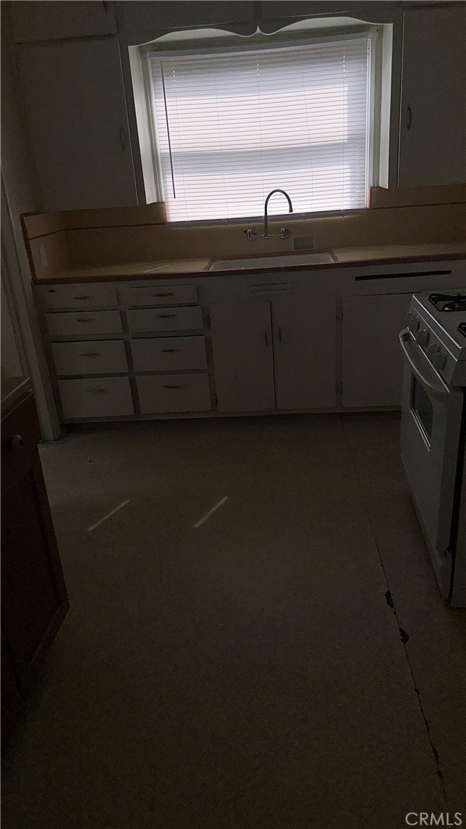 1888 Orchard Lane Merced, CA 95340 - Photo 22 of 28 a close view of sink and microwave