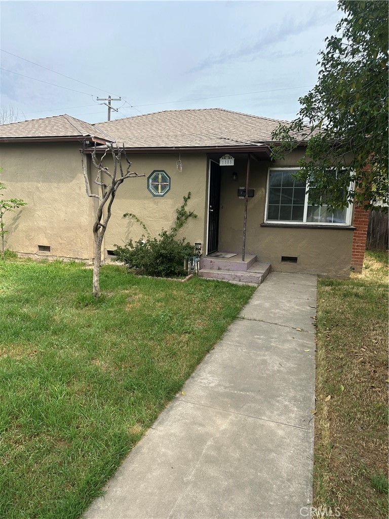 1888 Orchard Lane Merced, CA 95340 - Photo 4 of 28 a front view of a house with garden