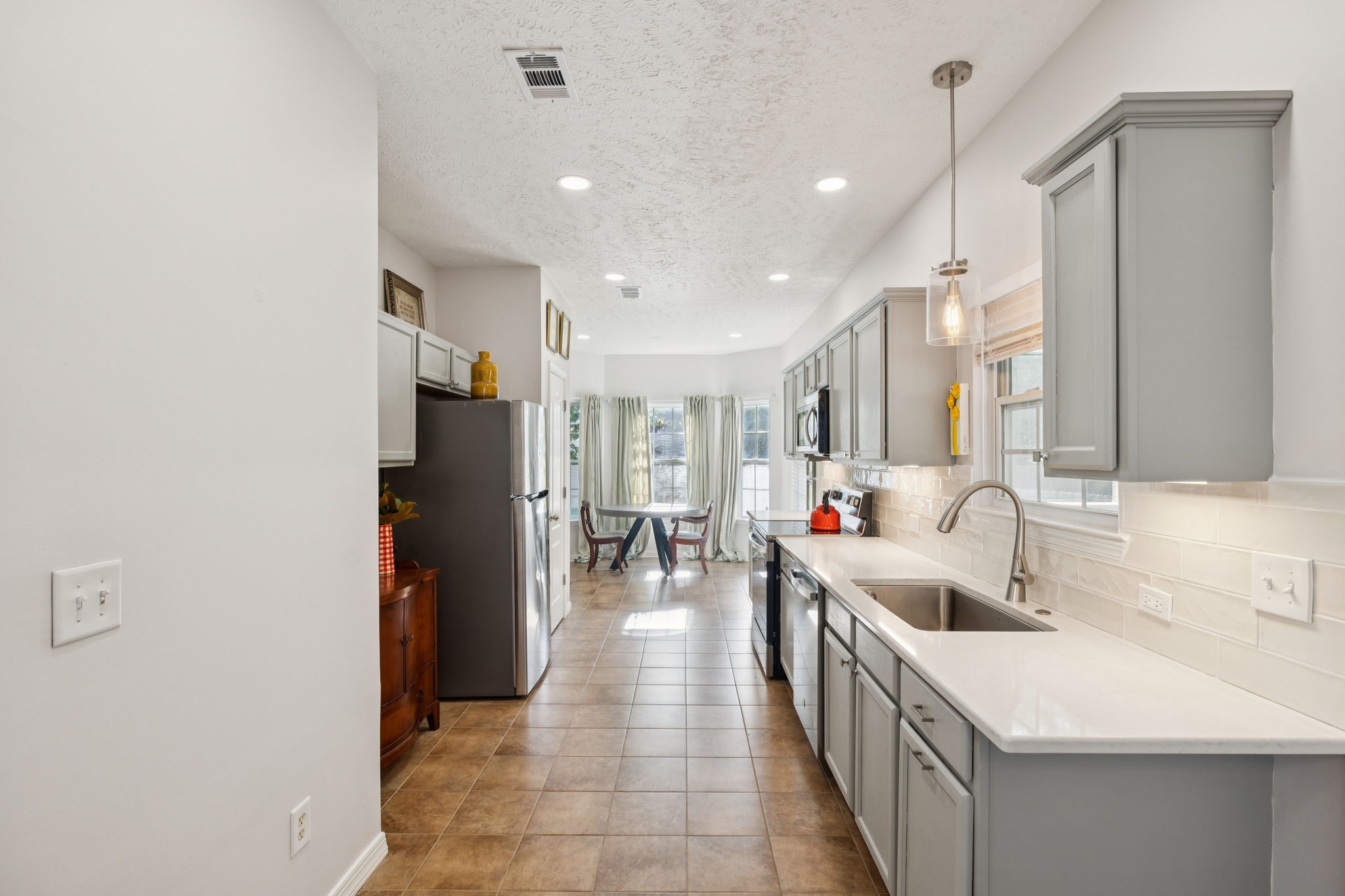 423 Knob Court Franklin, TN 37064 - Photo 13 of 37 a large white kitchen with a large window and refrigerator