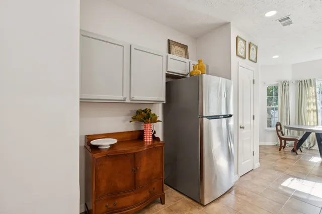 a kitchen with stainless steel appliances granite countertop a refrigerator a microwave and with a stove