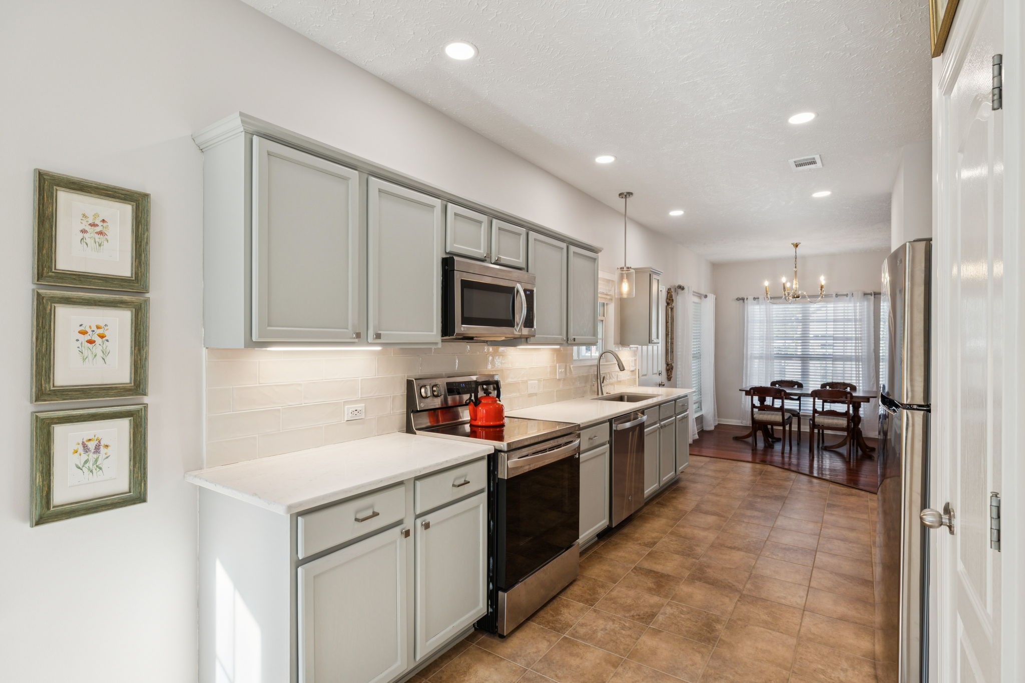 423 Knob Court Franklin, TN 37064 - Photo 15 of 37 a kitchen with a sink stove and cabinets
