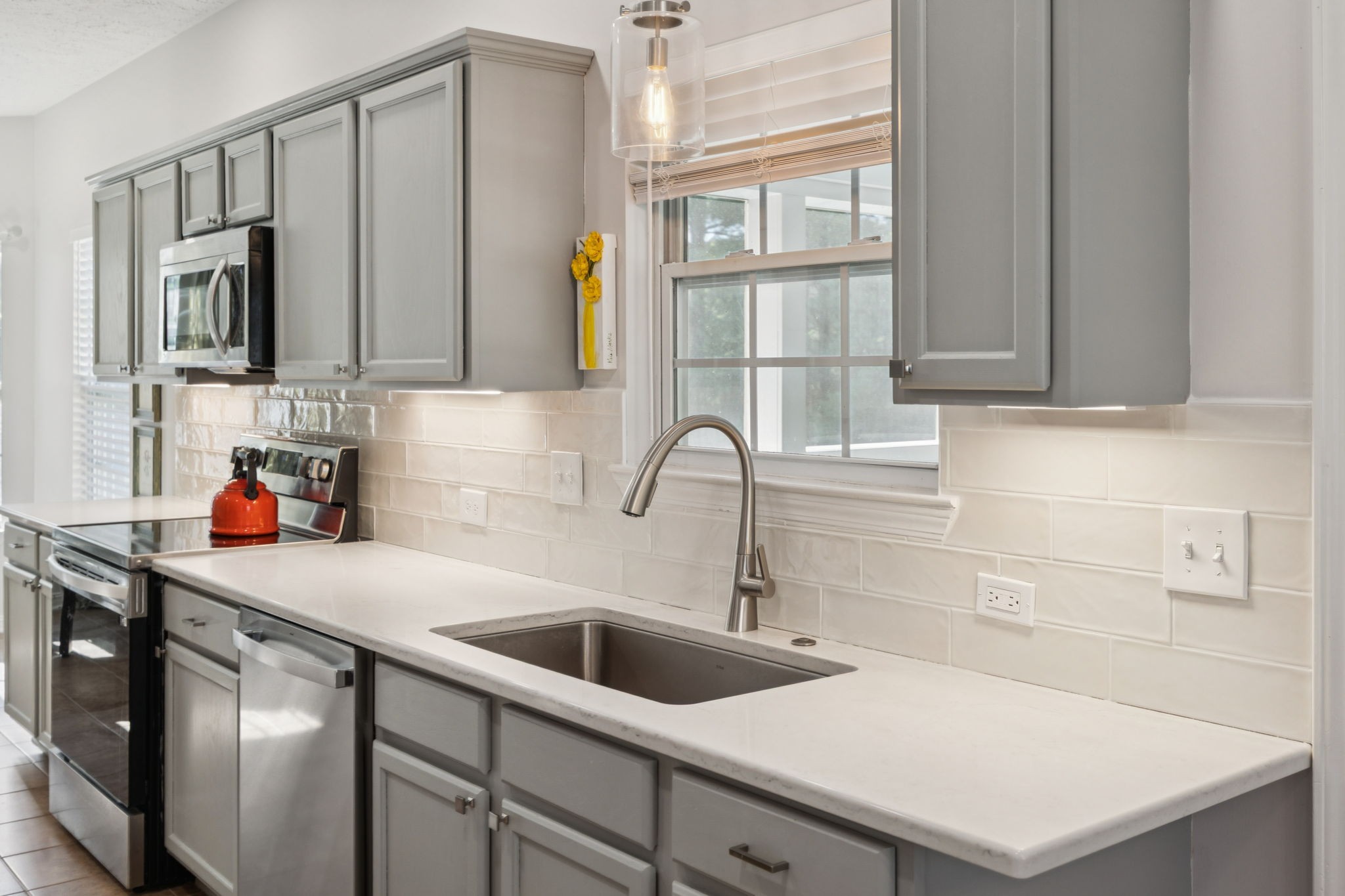 423 Knob Court Franklin, TN 37064 - Photo 17 of 37 a kitchen with stainless steel appliances a sink a stove and a refrigerator with cabinets