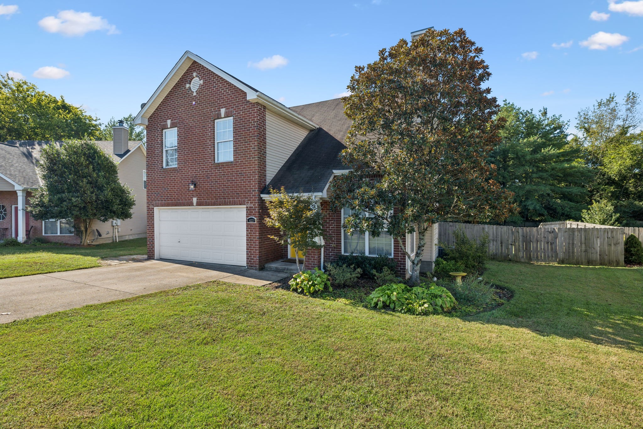 423 Knob Court Franklin, TN 37064 - Photo 2 of 37 a front view of a house with garden