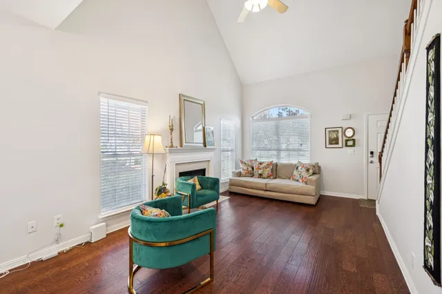 a living room with furniture and a fireplace