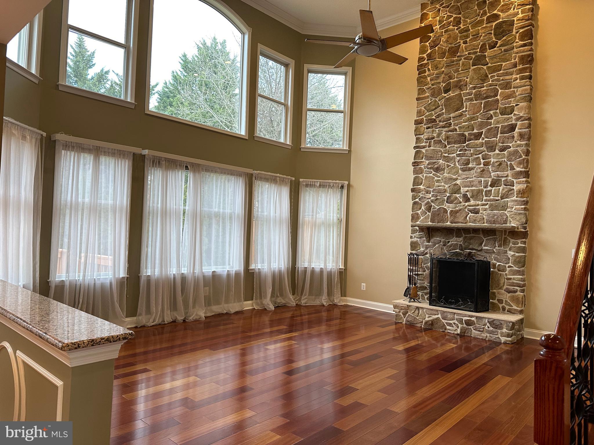 3215 Spring Rain Court Herndon, VA 20171 - Photo 11 of 39 an empty room with wooden floor and windows