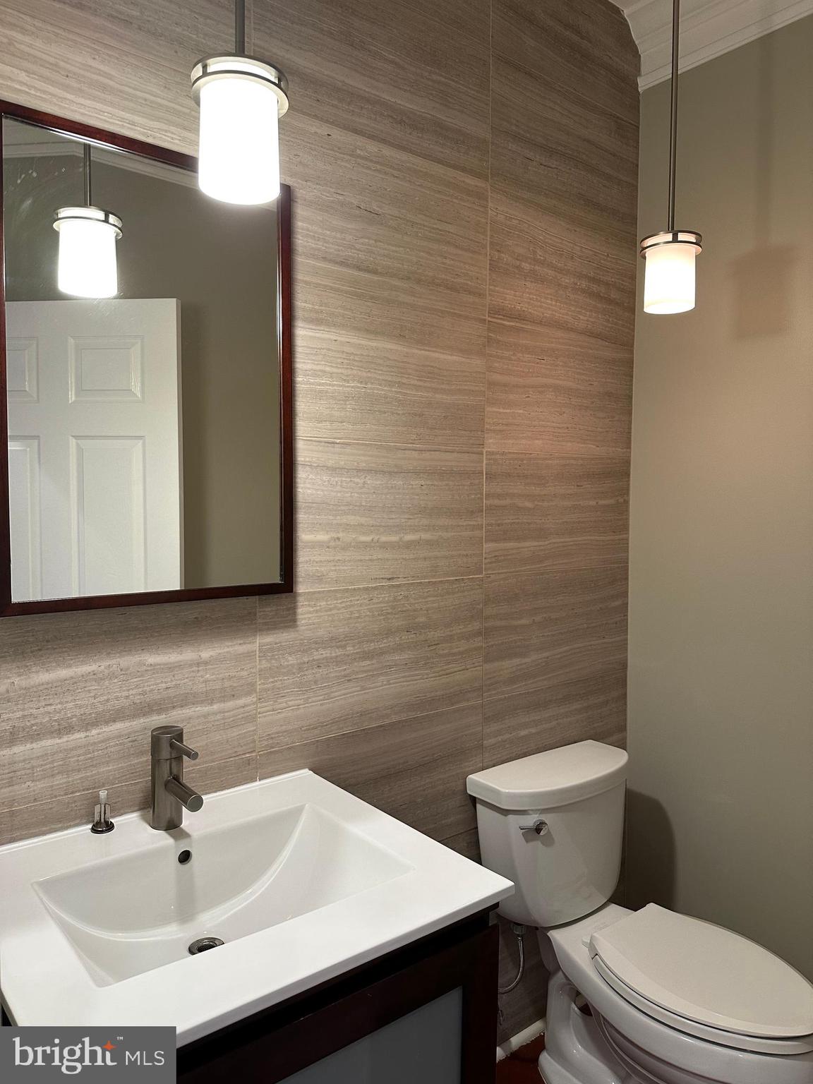 3215 Spring Rain Court Herndon, VA 20171 - Photo 15 of 39 a bathroom with a sink a toilet and mirror