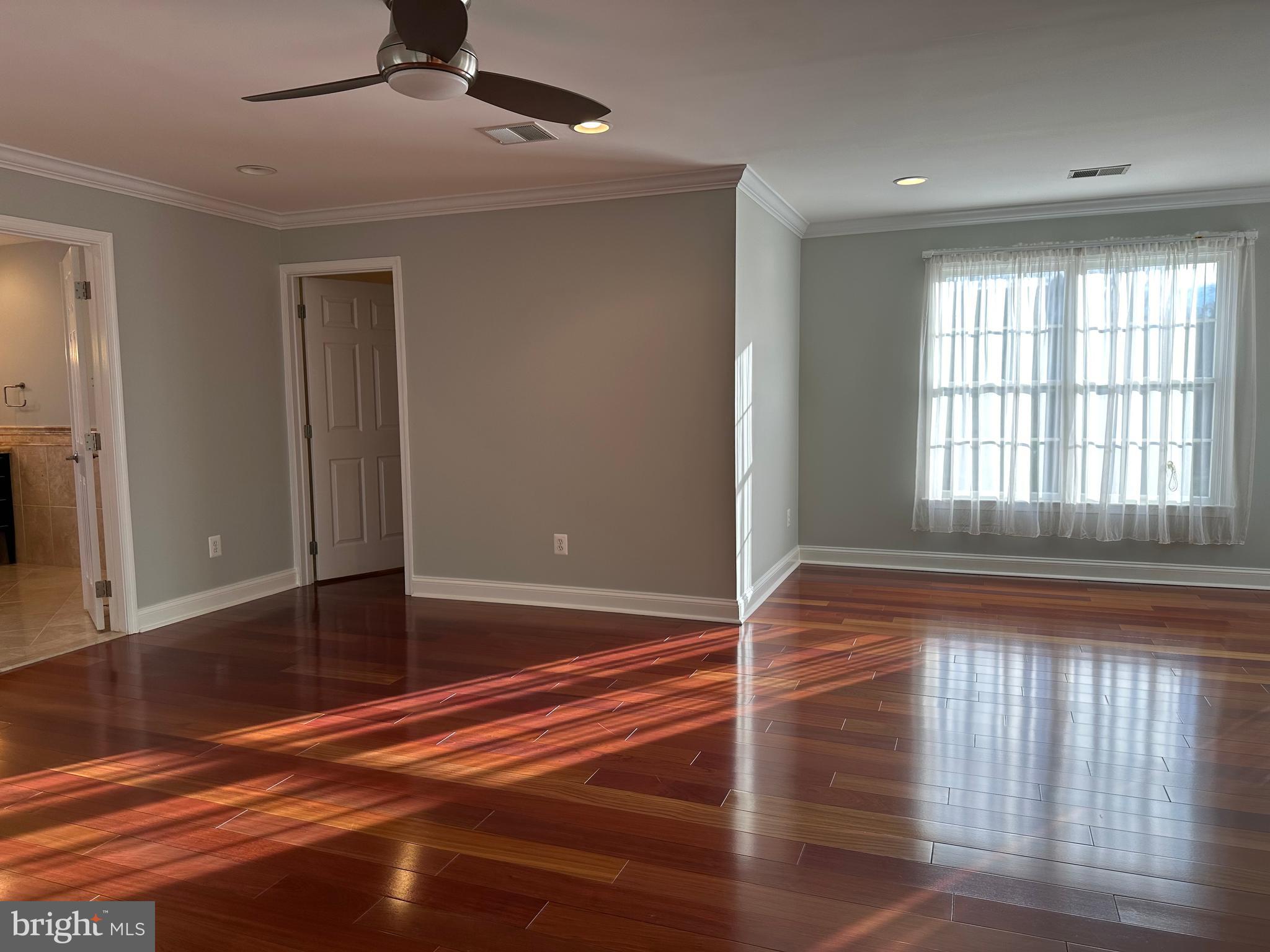 3215 Spring Rain Court Herndon, VA 20171 - Photo 19 of 39 a view of empty room with wooden floor and fan