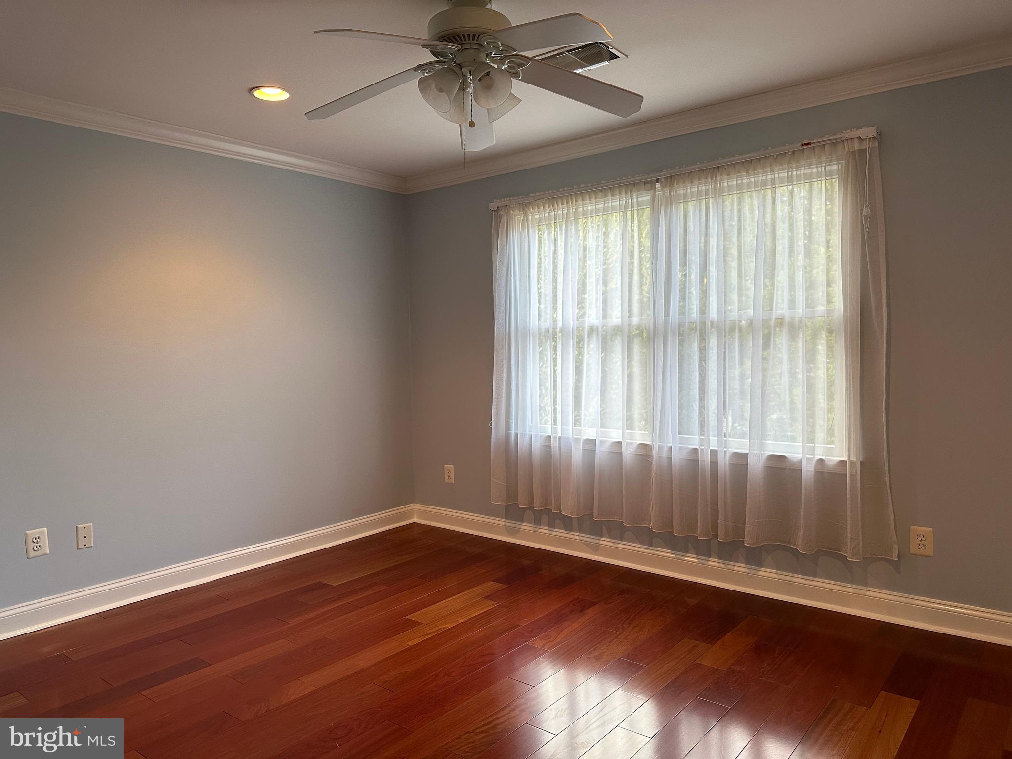 3215 Spring Rain Court Herndon, VA 20171 - Photo 25 of 39 an empty room with wooden floor and windows