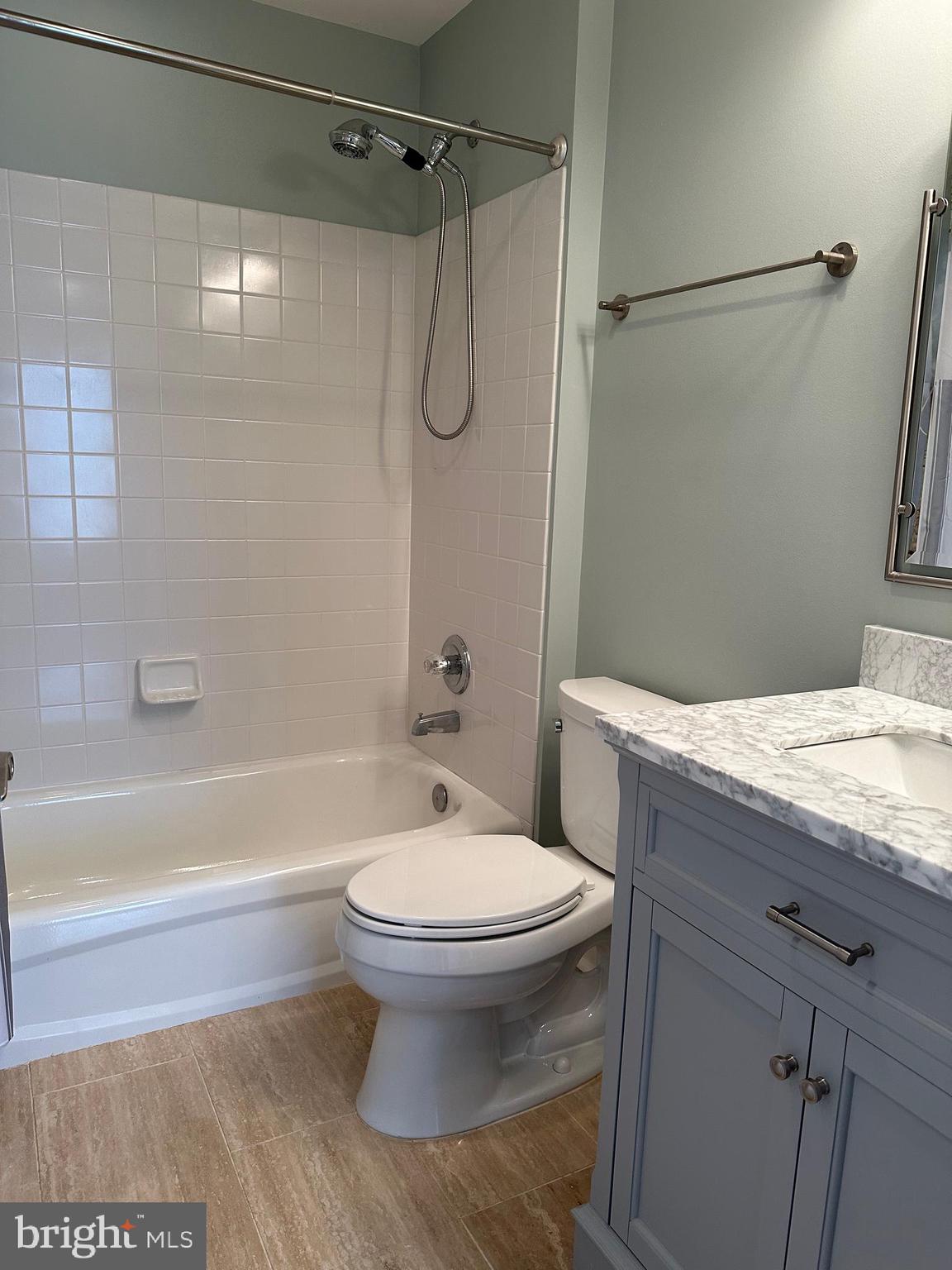 3215 Spring Rain Court Herndon, VA 20171 - Photo 28 of 39 a bathroom with a granite countertop bathtub shower sink vanity and toilet