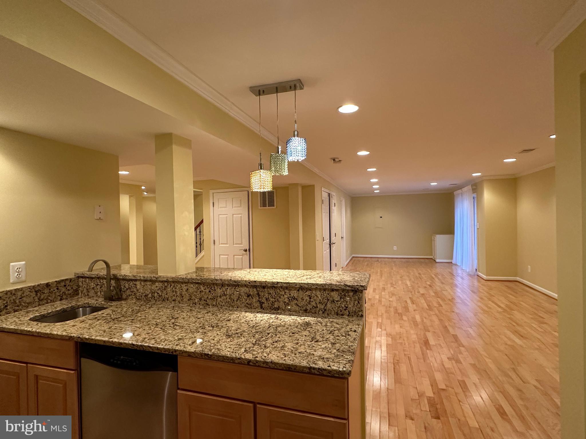 3215 Spring Rain Court Herndon, VA 20171 - Photo 34 of 39 a bathroom with a granite countertop sink a large mirror and a shower