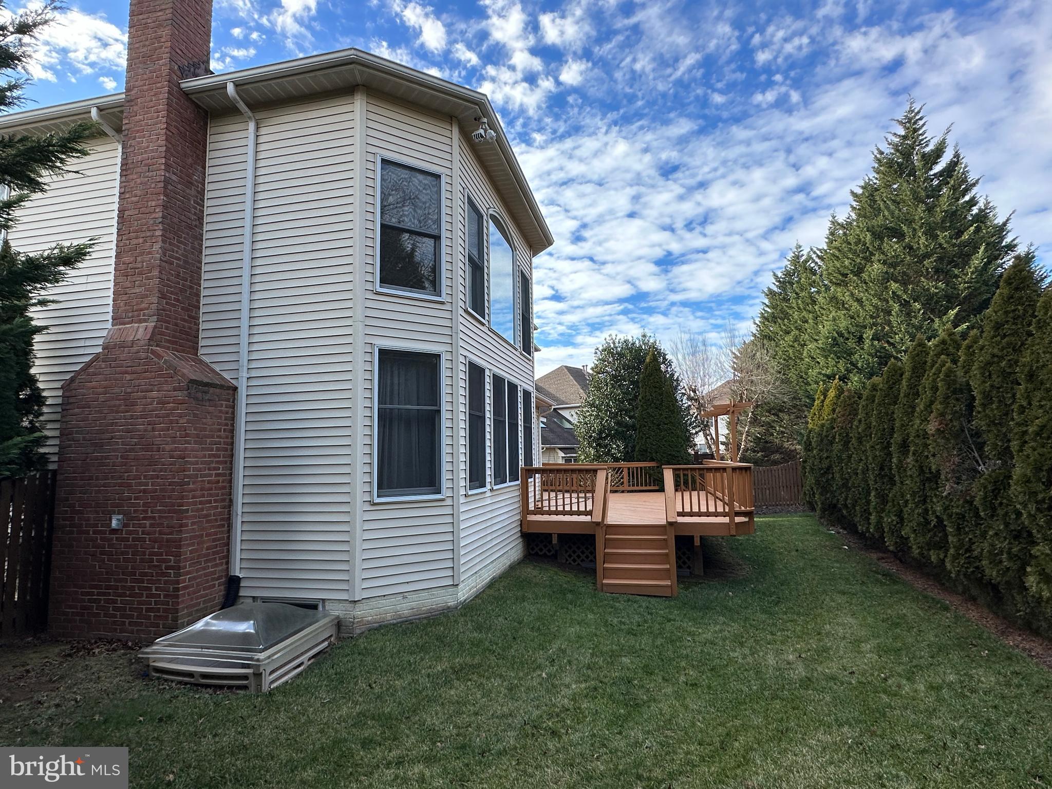 3215 Spring Rain Court Herndon, VA 20171 - Photo 37 of 39 a backyard of a house with table and chairs