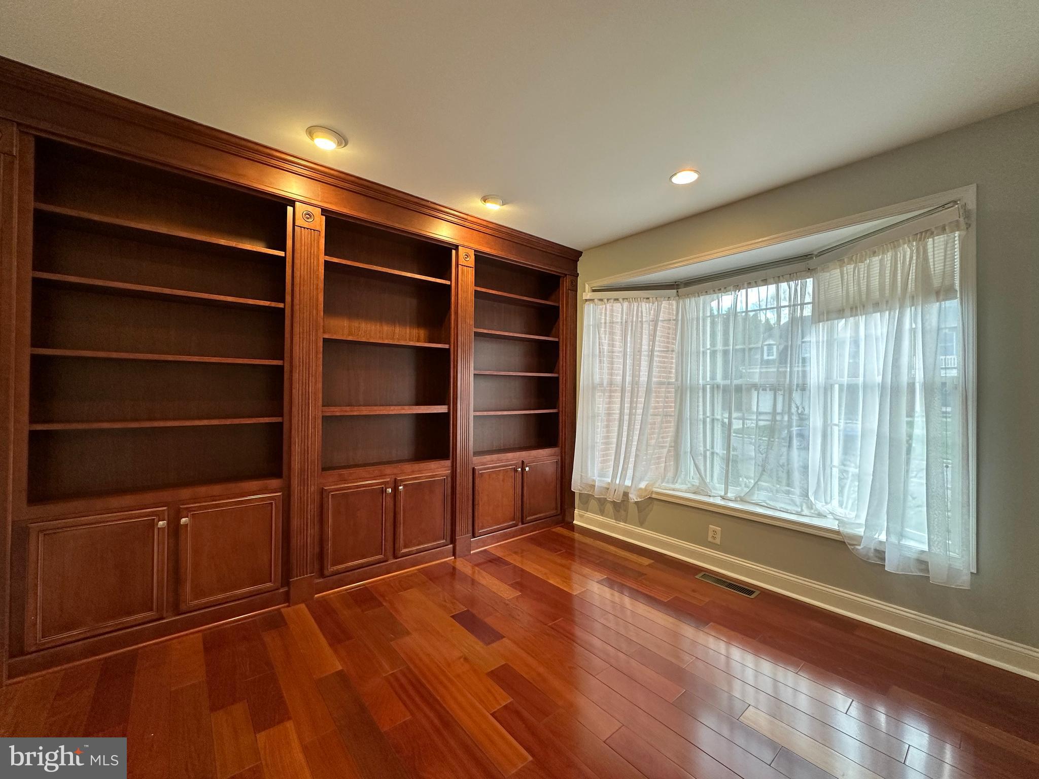 3215 Spring Rain Court Herndon, VA 20171 - Photo 5 of 39 a view of an empty room with a window and wooden floor