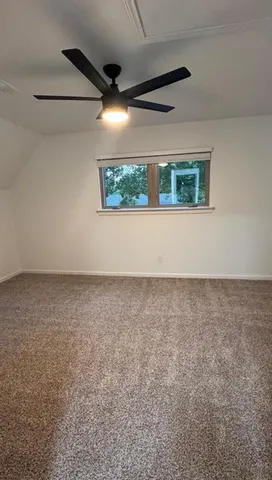 a bathroom with a shower and a toilet