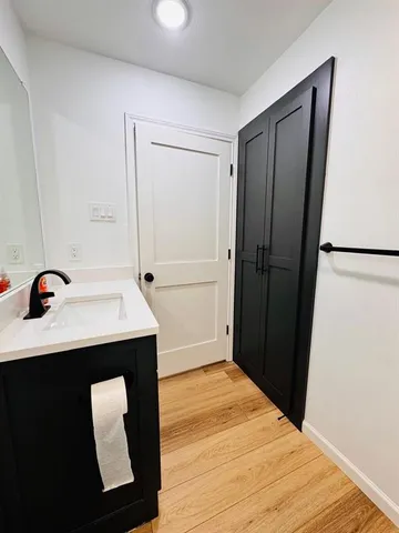 an empty room with a ceiling fan and window