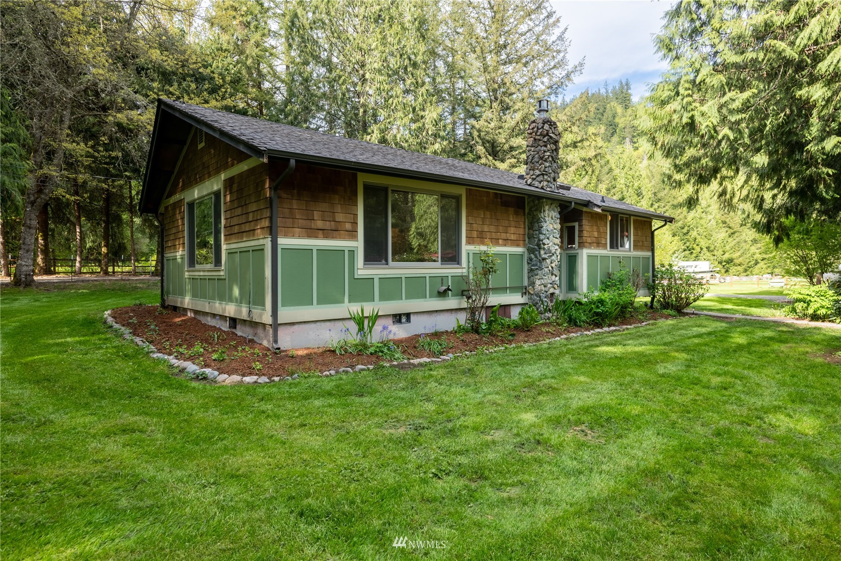 6262 North Fork Road Deming, WA 98244 - Photo 4 of 38 a view of a house with a yard
