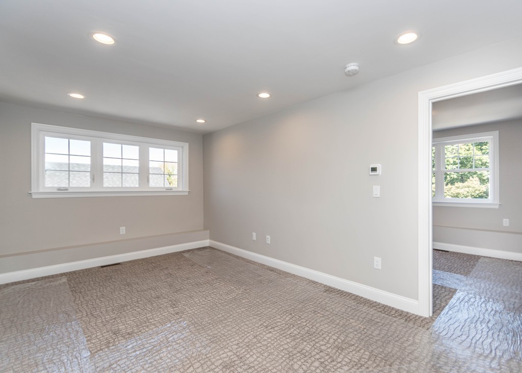 37 Riverside Street, Unit 37 Needham, MA 02494 - Photo 23 of 39 an empty room with windows and closet