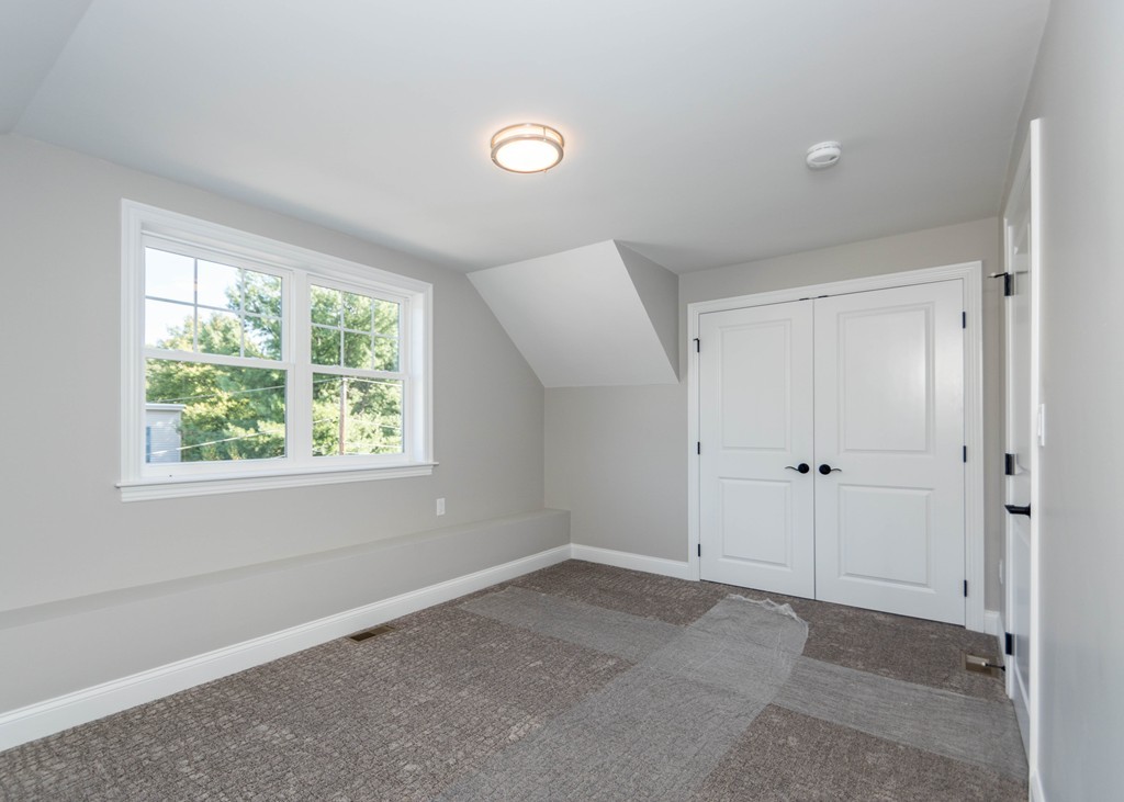 37 Riverside Street, Unit 37 Needham, MA 02494 - Photo 25 of 39 a view of an empty room with a window