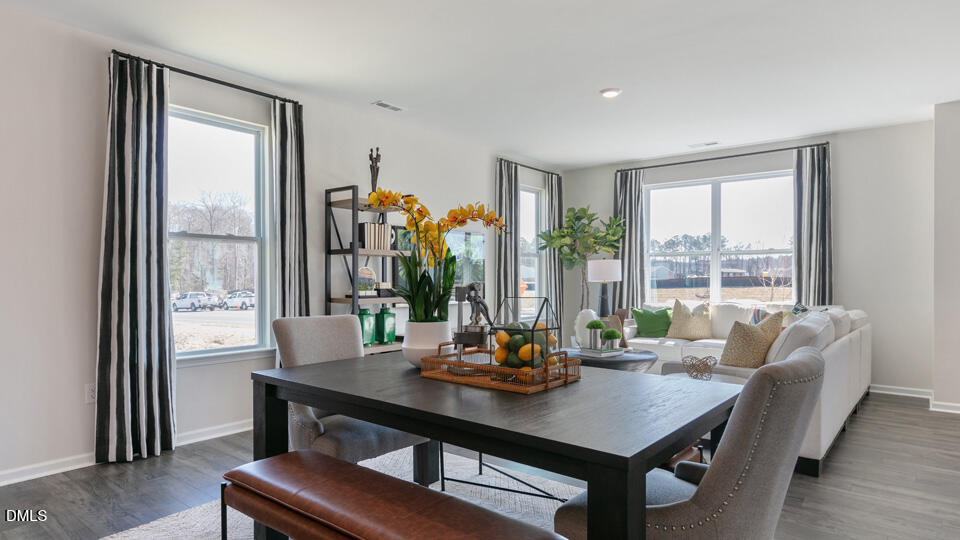 922 Sculptor Street Wendell, NC 27591 - Photo 14 of 51 a view of a dining room with furniture and window