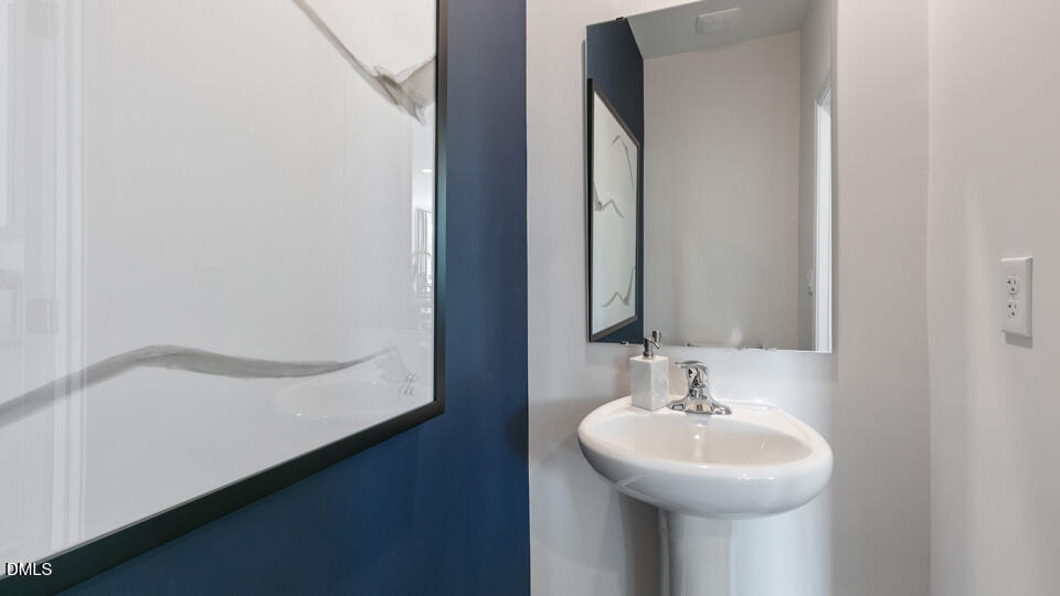 922 Sculptor Street Wendell, NC 27591 - Photo 16 of 51 a bathroom with a sink and a mirror