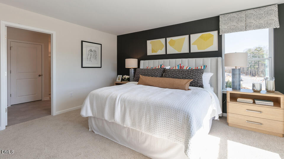 922 Sculptor Street Wendell, NC 27591 - Photo 18 of 51 a bedroom with a bed and a window