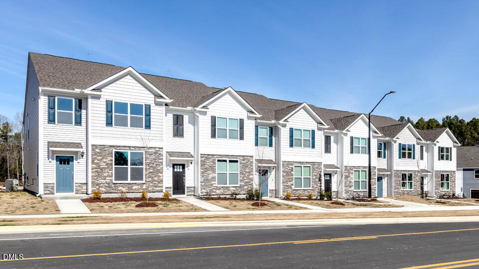 922 Sculptor Street Wendell, NC 27591 - Photo 2 of 51 a front view of residential houses