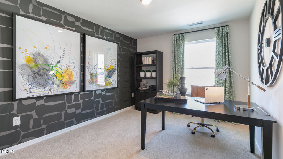 922 Sculptor Street Wendell, NC 27591 - Photo 23 of 51 a view of a workspace with furniture and a window