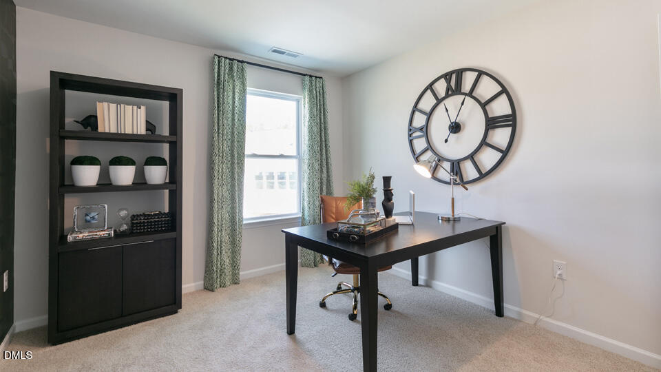922 Sculptor Street Wendell, NC 27591 - Photo 24 of 51 a view of a room with a table and chairs