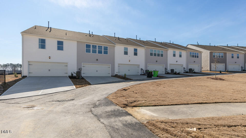 922 Sculptor Street Wendell, NC 27591 - Photo 35 of 51 a front view of a house with a yard