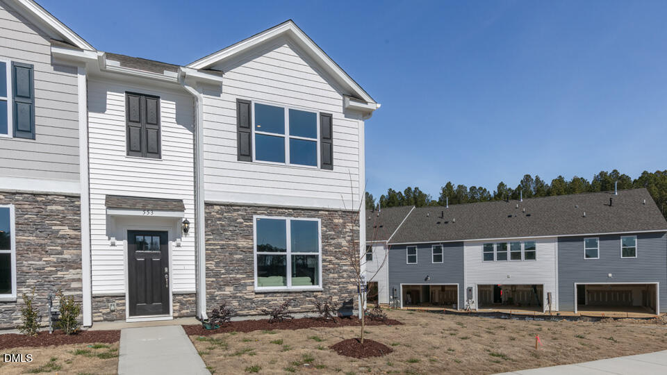 922 Sculptor Street Wendell, NC 27591 - Photo 4 of 51 a front view of a house with a yard