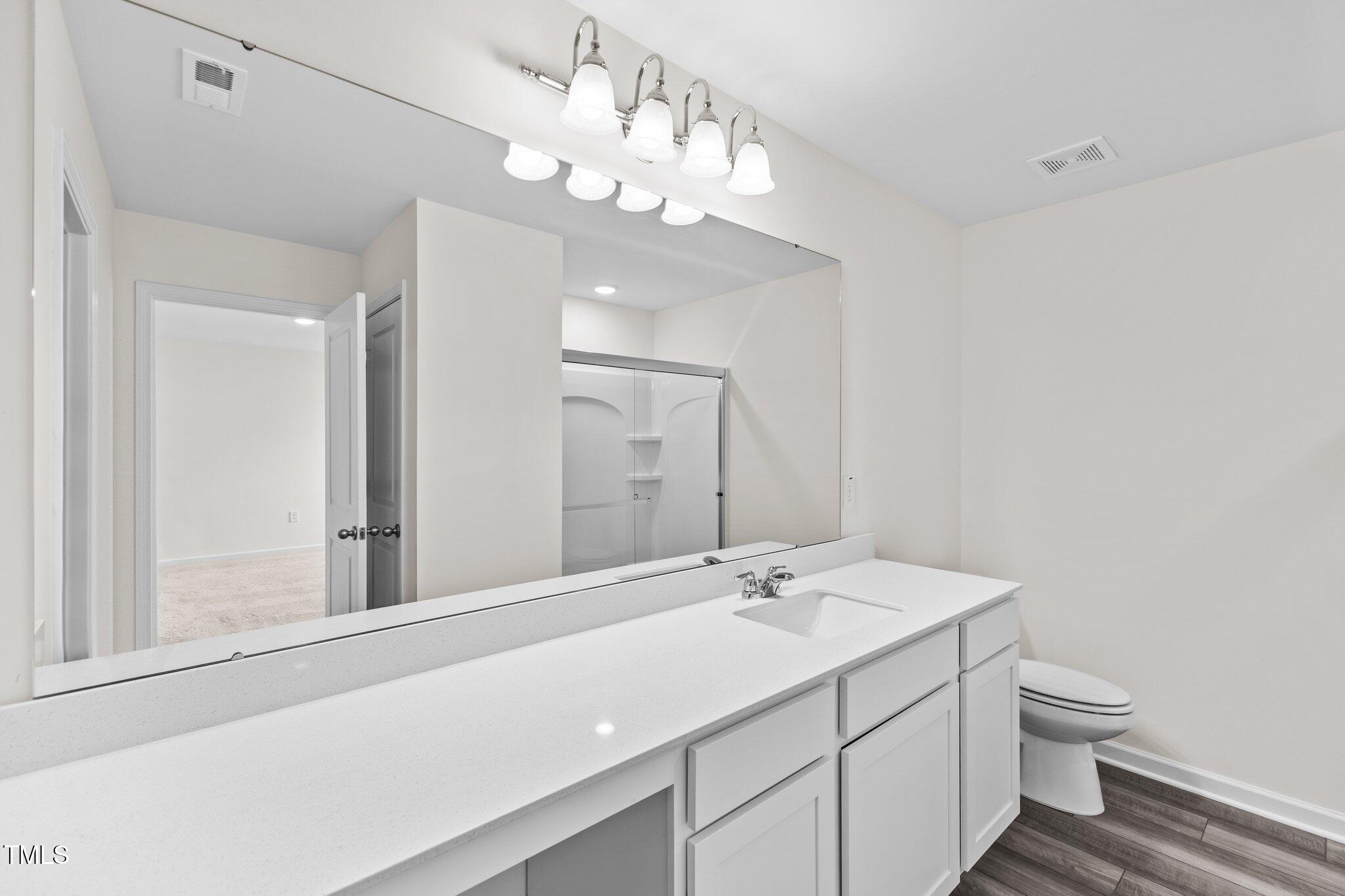109 Gladstone Loop Clayton, NC 27520 - Photo 11 of 21 a bathroom with a sink vanity granite and toilet